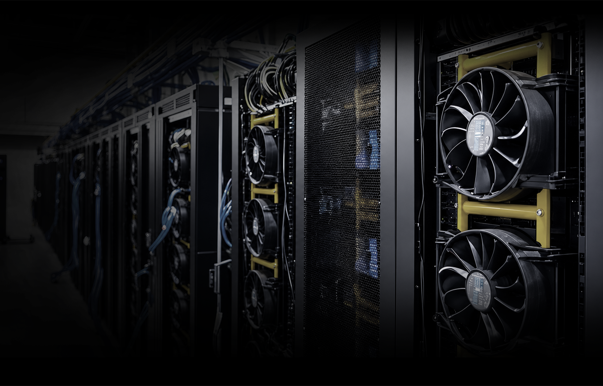 Server racks with large cooling fans and gold mounting rails